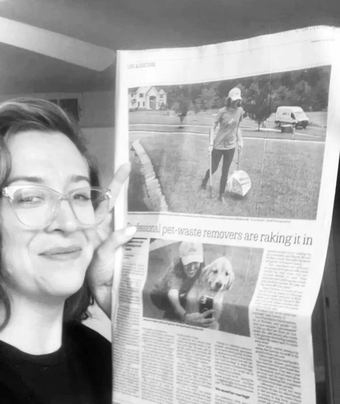 Holding up the printed Philadelphia Inquirer story about Big Business Scoopers